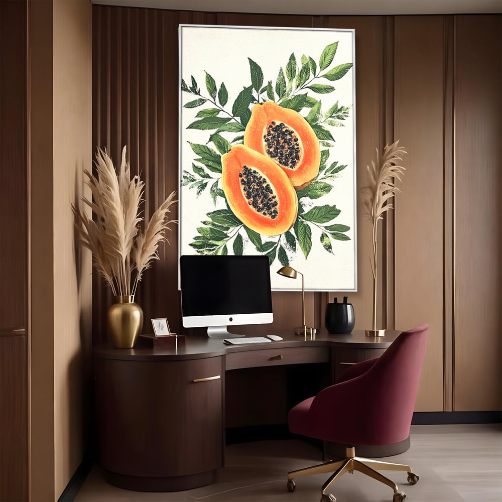 Tablou canvas cu ilustratie cu papaya si frunze tropicale, in rama de aluminiu argintiu, pe perete intr-un birou